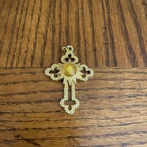 Beautiful and substantial gold cross charm.